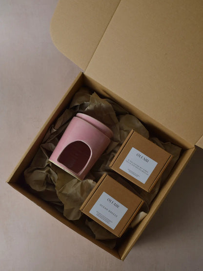 Geschenkset bestehend aus einer Duftlampe in altrosa, 6 Teelichter inkl. einer Hülle und Duftwachs Ocean Breeze.