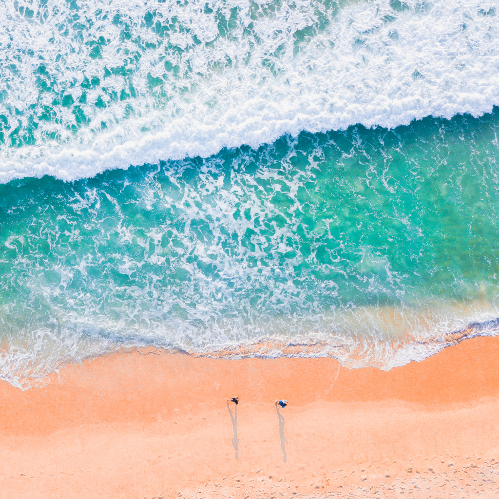 aerial picture of ocean and sand