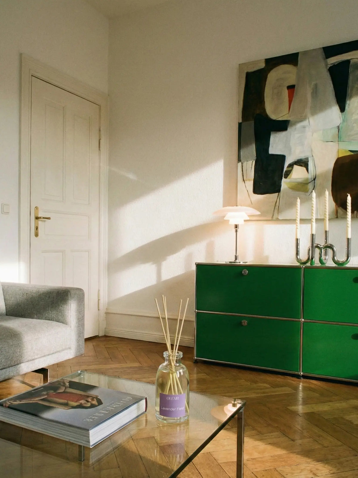 Lavender Field room fragrance on the coffee table in a sunny living room