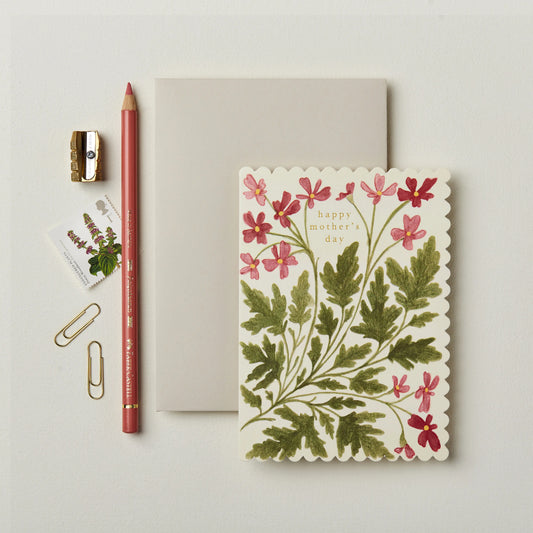 Muttertagskarte "Happy Mother's Day" mit einem floralen Muster auf einem hellen Hintergrund.